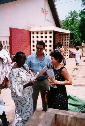 Administering surveys with parents at a church in Accra.